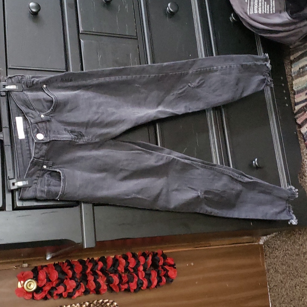 Distressed black skinny jeans